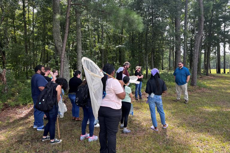 Group of students listening to community partner share about the Culture Center.