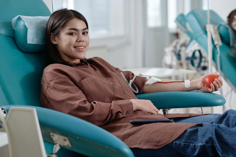 female UNCP student donating blood on UNC Pembroke campus